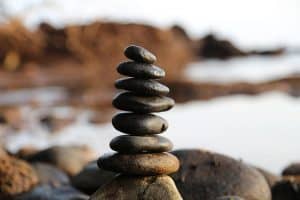 pile of rocks balanced along the beach