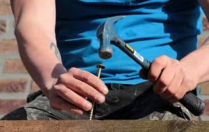 carpenter hammering a nail