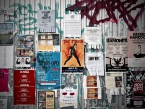 various advertising posters on a wall