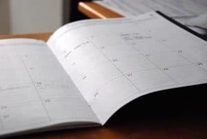 monthly schedule open on desk
