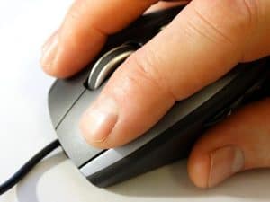 fingers clicking on a mouse