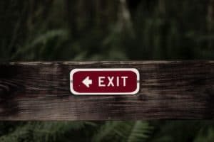 exit sign on wooden plank