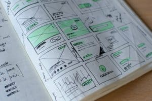 notebook open to page with various wireframes