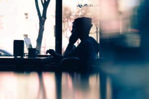 profile of an assistant taking a phone call