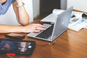 woman creating content in a laptop