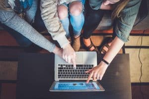 friends looking at a laptop