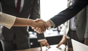 handshake between woman and man