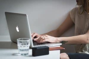 woman using her MacBook